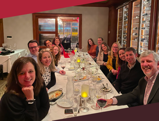 JAG employees enjoying dinner together - JAG Management Company Jefferson Apartment Group development jobs